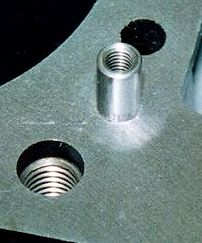 This is the top of the restrictor and shows the threads which are used to pull it out of the block