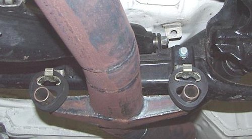 An E30 M3 Gr A exhaust passes under the rear subframe 