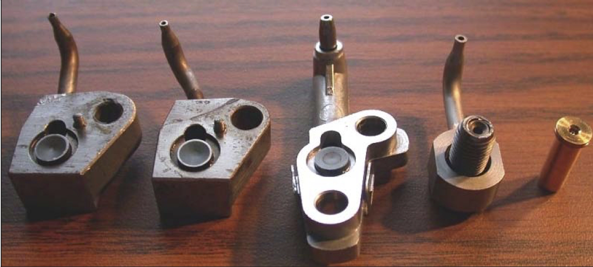 A variety of oil squirters that could be used on an S14 engine