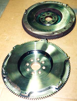 The Evo II Lightweight flywheel compared to the stock flywheel